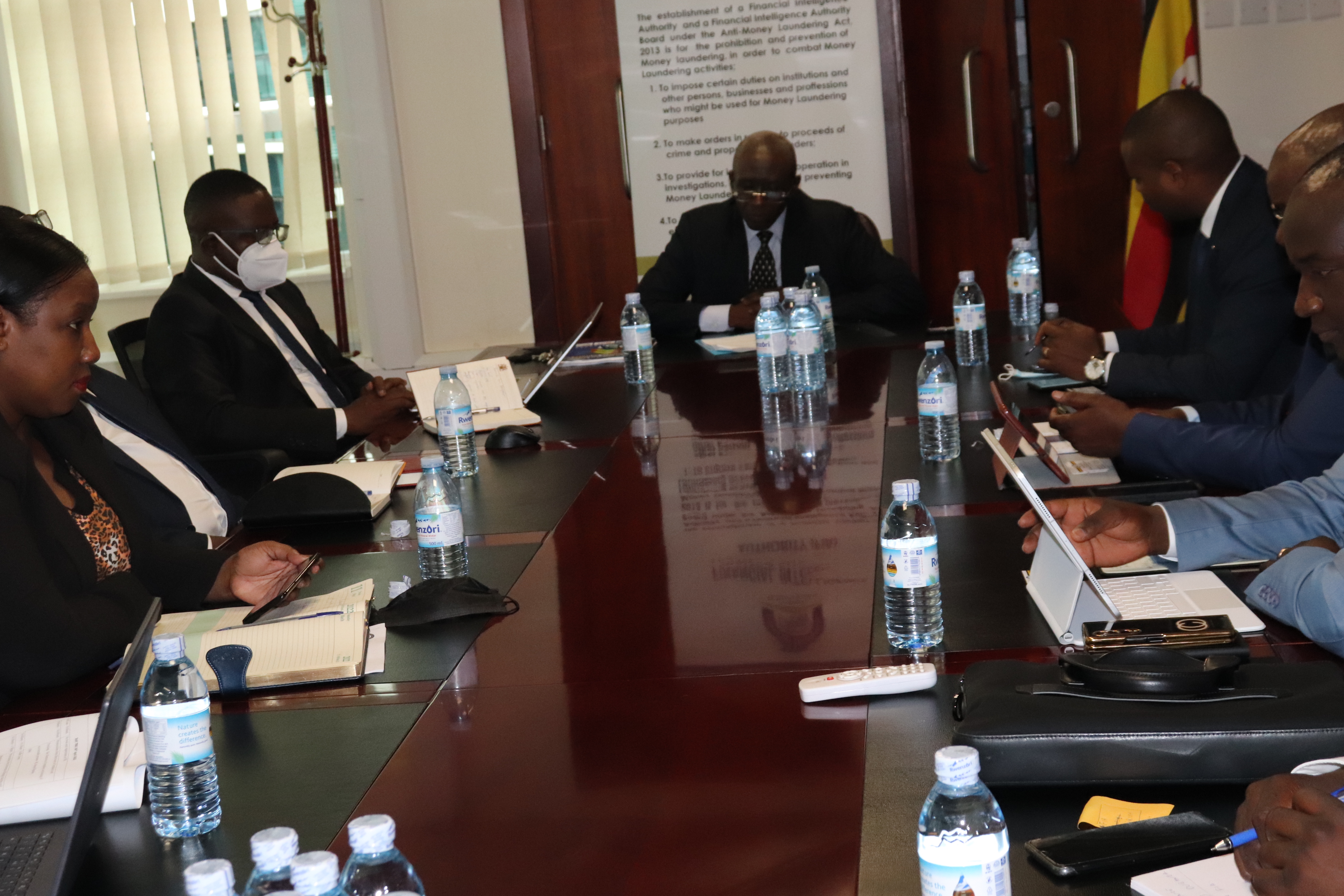 Deputy ED-FIA(center) presents to Burundi FIU delegates-benchmarking visit